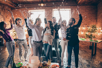 Canvas Print - Photo of group amazing friends throwing confetti surprise baby party meeting future parents big cake champagne snacks on table formalwear restaurant indoors