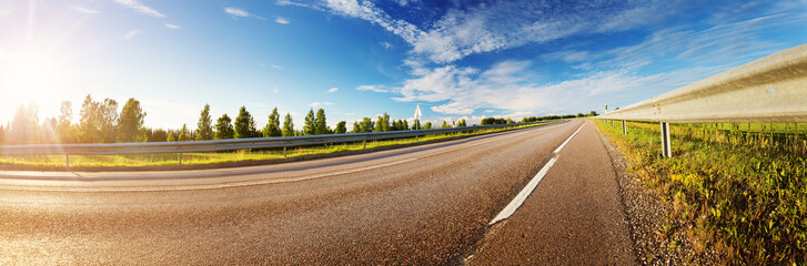 Wall Mural - asphalt road panorama in countryside on sunny summer day