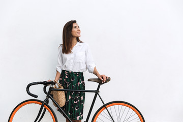 Smiling young brunette woman wearing summer clothes