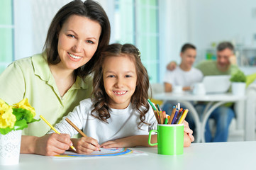 Canvas Print - Portrait of little cute girl with mother drawing