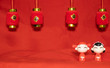 © Bonn - The Chinese New Year decoration on a red background Chinese Couple Figure Model wish for a Luck  and lump of gold and a Chinese Word on Lantern  said Luck