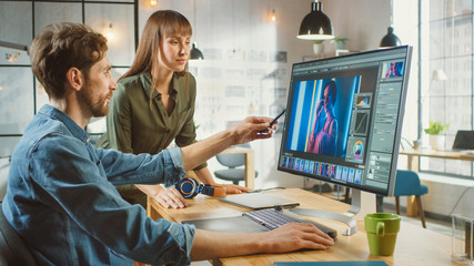 Poster - Female Art Director Consults Designer Colleague, They Work on a Portrait in Photo Editing Software. They Work in a Cool Office Loft. They Look Very Creative and Cool.
