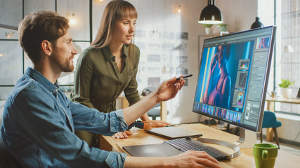 Poster - Female Art Director Consults Designer Colleague, They Work on a Portrait in Photo Editing Software. They Work in a Cool Office Loft. They Look Very Creative and Cool.