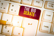 Text sign showing The Big Debate. Business photo text Lecture Speech Congress presentation Arguments Differences White pc keyboard with empty note paper above white background key copy space