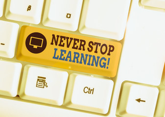 Wall Mural - Writing note showing Never Stop Learning. Business concept for keep on studying gaining new knowledge or materials White pc keyboard with note paper above the white background