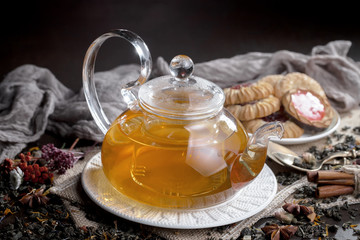 Tea hot drink on old background in composition on the table