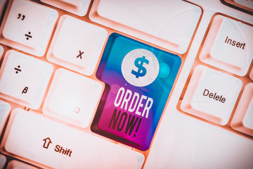 Text sign showing Order Now. Business photo text confirmed request by one party to another to buy sell White pc keyboard with empty note paper above white background key copy space
