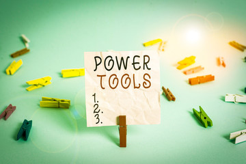 Poster - Handwriting text Power Tools. Conceptual photo tool that is actuated by additional power source and mechanism Colored clothespin rectangle square shaped paper light blue background