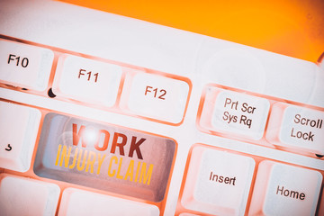 Conceptual hand writing showing Work Injury Claim. Concept meaning Medical care reimbursement Employee compensation White pc keyboard with note paper above the white background