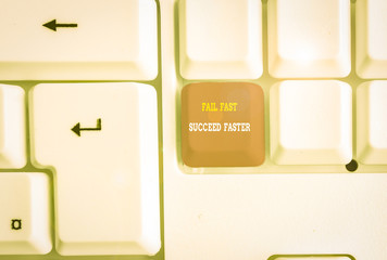 Text sign showing Fail Fast Succeed Faster. Business photo text dont give up keep working on it to achieve White pc keyboard with empty note paper above white background key copy space