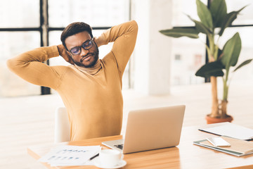 Aufkleber - Happy afro manager stretching hands at work