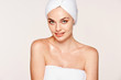 © Indico Studio/ADDICTIVE STOCK - Good-looking woman with moisturized skin posing in towel on face and body isolated on white background