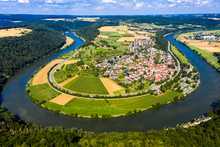 Germany, Bavaria, Binau, Aerial View Of River Curving Around Countryside Town