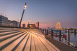 © Westend61 - Germany, Hamburg, Steps by river and Elbphilharmonie in distance at dusk
