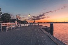 Germany, Hamburg, Pier On Outer Alster Lake At Sunrise
