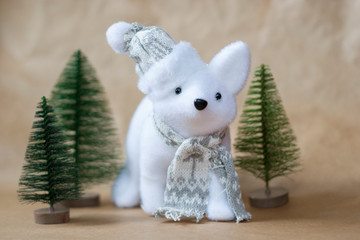 White toy fox and christmas tree