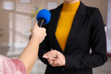 Professional Journalist Interviewing Young Woman In Room, Closeup