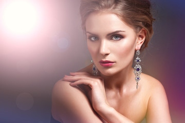 Wall Mural - Beautiful woman with evening make-up. Jewelry and Beauty. Fashion photo