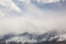 Winter Landscape Of The Eastern Sierra Nevada Mountains Framed By Clouds, California, USA
