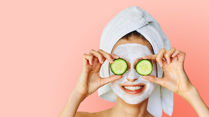 Wall Mural - cosmetology, skin care, face treatment, spa and natural beauty concept. woman with facial mask holds