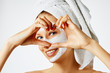 © Olesia - Cosmetology, skin care, face treatment, spa and natural beauty concept. Woman with facial mask.
