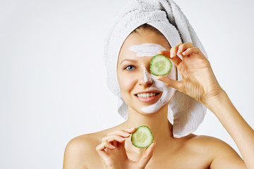 Wall Mural - cosmetology, skin care, face treatment, spa and natural beauty concept. woman with facial mask holds