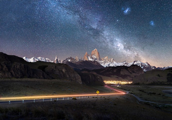 Wall Mural - beautiful light trails towards remote town el chalten - fitz roy mountain visible under milky way