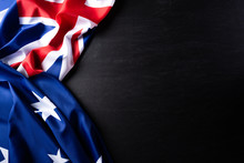 Australia Day Concept. Australian Flag With The Text Happy Australia Day Against A Blackboard Background. 26 January.