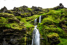 Closeup Top Of Seljalandsfoss Waterfall In Iceland With Water Falling Off Cliff In Green Mossy Summer Long Exposure Smooth Flowing