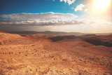 Fototapeta  - Mountain nature landscape. Desert in early morning. Beautiful sunrise in mountains. Judaean Desert. View of valley with mountains on backdrop. Nature Israel.
