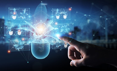 Fototapete - Man hand holding and touching holographic projection of a plant with digital analysis 3D rendering