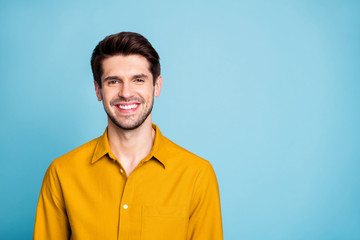 Poster - Photo of handsome creative executive director wearing yellow shirt smiling toothily isolated over blue pastel color background