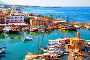 Panoramic view of Kyrenia (Girne) old harbour on the northern coast of Cyprus. Kyrenia seaside of Mediterranean Sea, Cyprus. Famous places and travel destination of Kyrenia, Cyprus