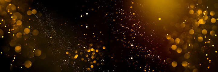 golden abstract bokeh on black background. holiday concept