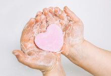 Importance Of Personal Hygiene Care. Flat Lay View Of Child Washing Dirty Hands With Pink Heart Shape Soap Bar, Lot Of Foam. Copy Space.