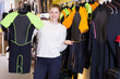 © JackF - woman is standing with diving costumes