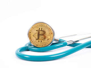 Cryptocurrency medical concept with a gold bitcoin coin