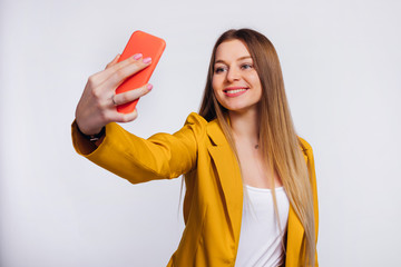 Wall Mural - The girl is dressed in a yellow jacket and a white blouse. girl