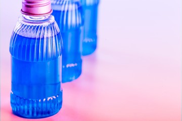 Canvas Print - The medical plastic bottle with oil on the desk