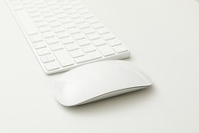Keyboard and mouse on white background, close up