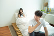 © mkitina4 - Asian man depresses and woman with unhappy relationship sit on bed after have an argument,social problem in couple live.