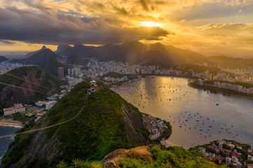 Fototapete - Sunset view of   Corcovado, Urca and Botafogo in Rio de Janeiro, Brazil. Sunset skyline of Rio de Janeiro