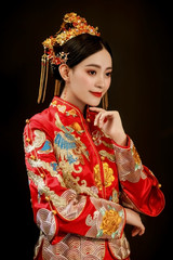 Wall Mural - Asian bride wearing chinese wedding costume