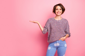 Portrait of her she nice attractive lovely pretty charming cheerful cheery brown-haired girl holding on palm advice solution decision advert isolated over pink pastel color background