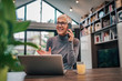 © bnenin - Beautiful smiling senior woman talking on smart phone.