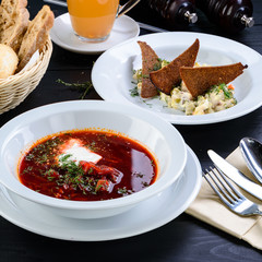 Wall Mural - Russian three-course dinner, borsch and Olivier salad