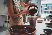 Closeup Of Female Hands Glazing Handmade Big Bowl In Modern Pottery Workshop,  Handcraft Creative People Ceramic Art Design Pottery Making Process
