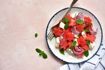 Wall Mural - Watermelon salad with feta cheese, red onion and mint. Top view with copy space.