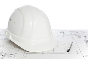 White hard hat on construction plan