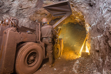 Canvas Print - Underground gold mine shaft tunnel drift with rails